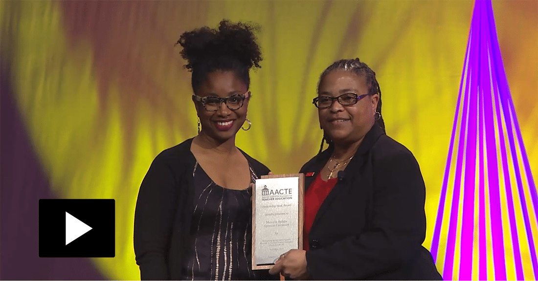 Dr. Marcelle Haddix receiveing her award