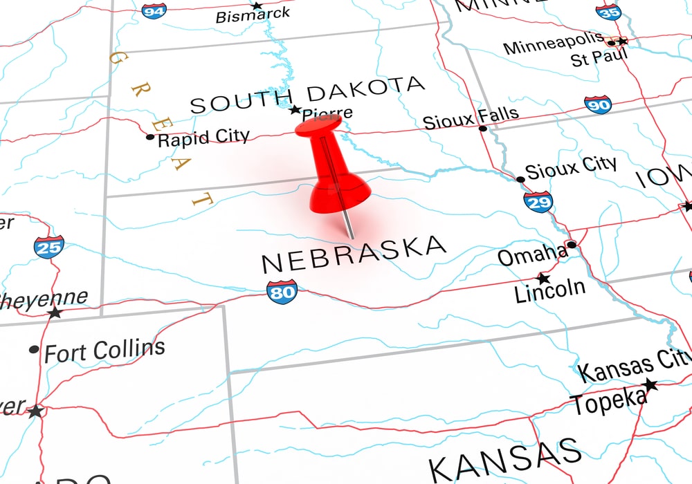 Red Thumbtack Over Nebraska State USA Map