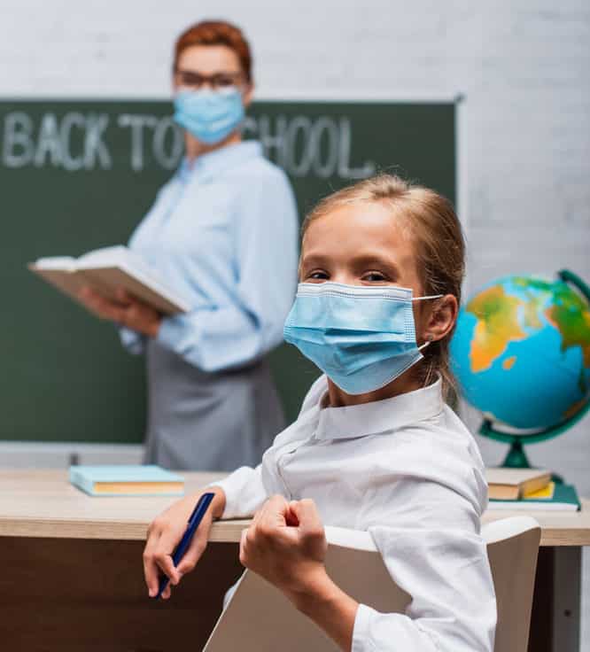 Student and teachers wearing masks in the classroom