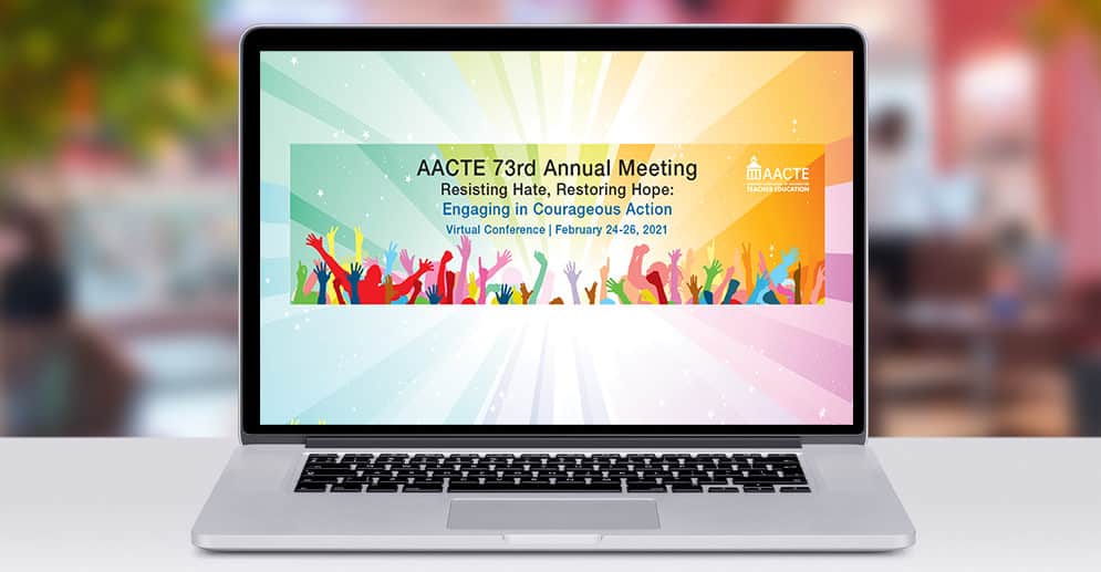 Front view of modern laptop with #AACTE21 logo on screen.