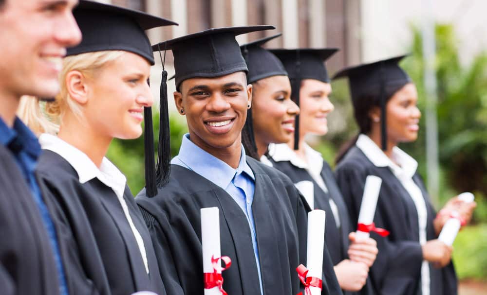 happy multiracial university students graduation